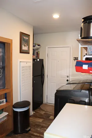 a view of a hallway with closet and a living room