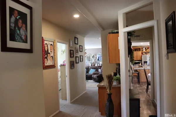 a living room with furniture and a walk in closet