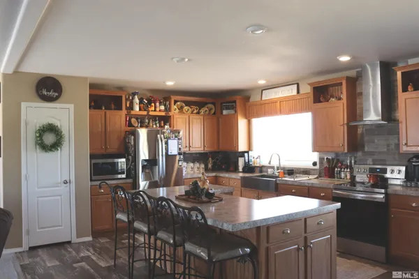 a kitchen with sink refrigerator and stove