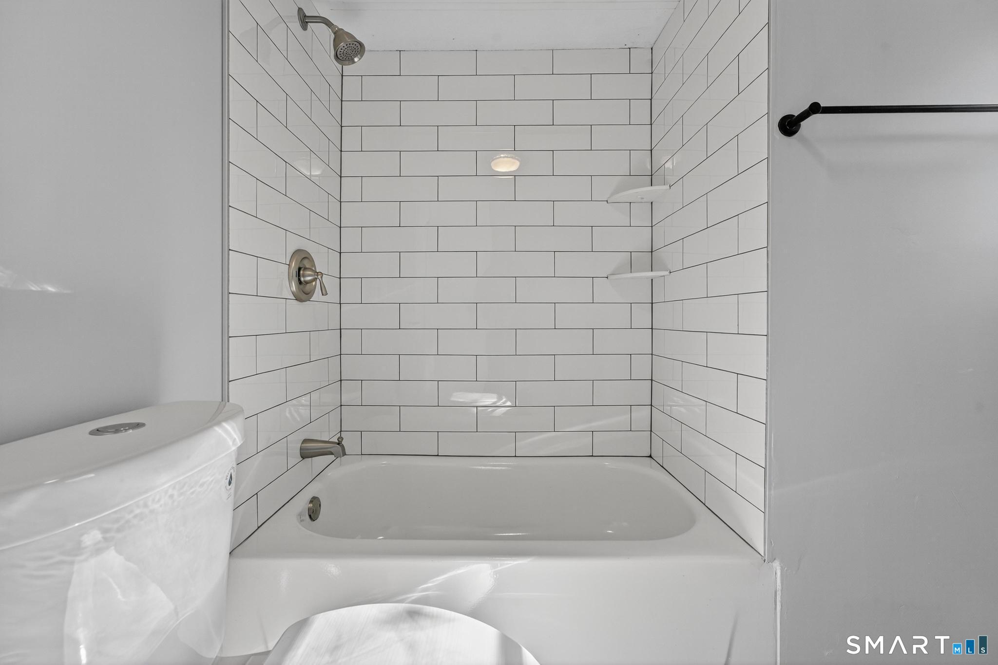 32 Nashua Street Norwich, CT 06360 - Photo 16 of 19 a bathroom with a bathtub
