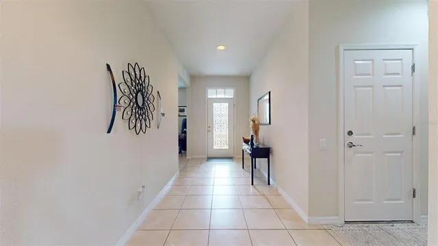 a view of a hallway with closet and a couch
