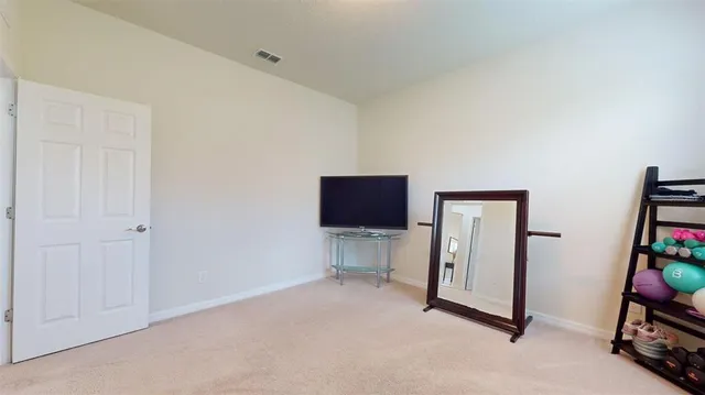 a view of an empty room and workspace