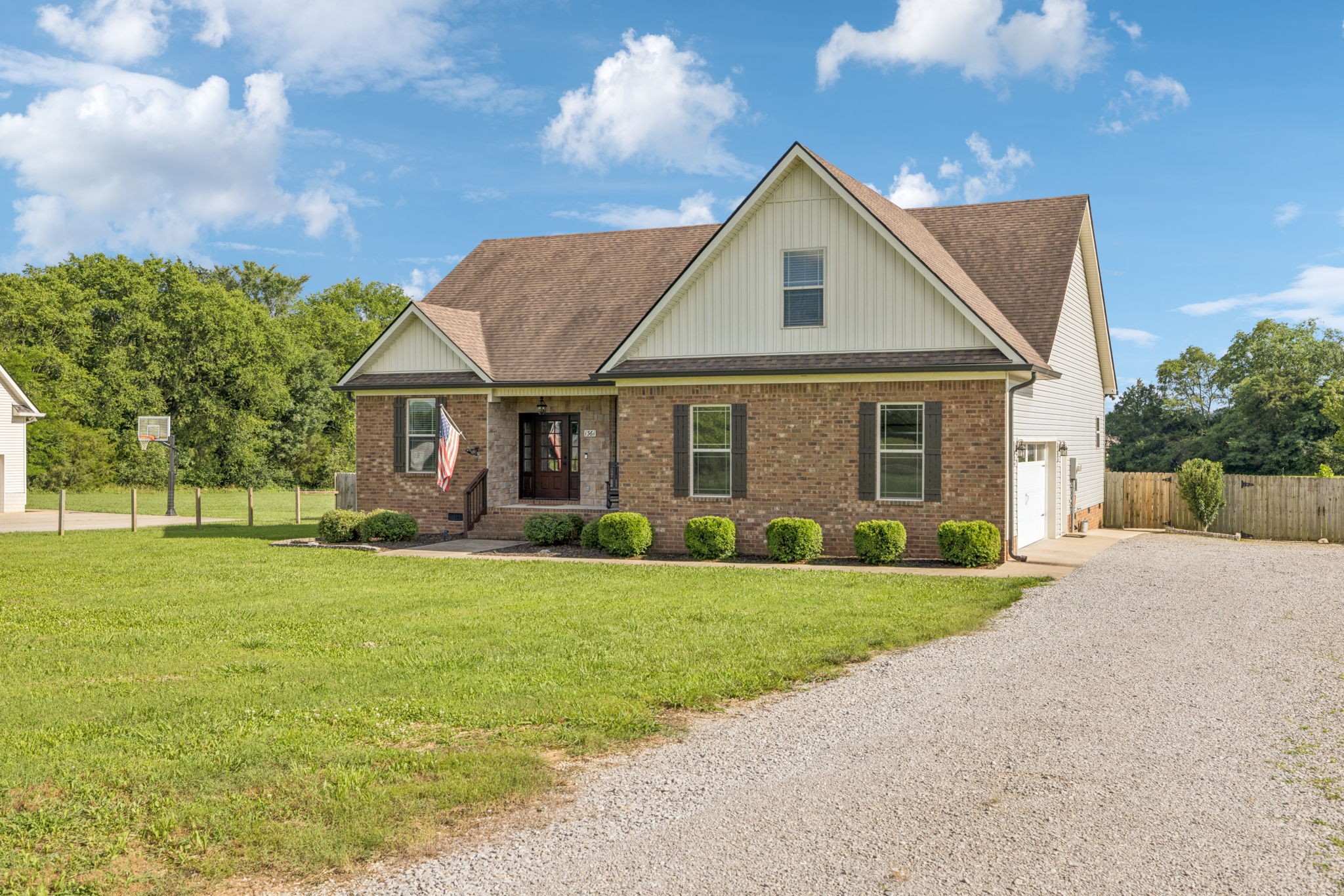 1361 Neil Road Chapel Hill, TN 37034 - Photo 3 of 24 a front view of a house with a yard and garage
