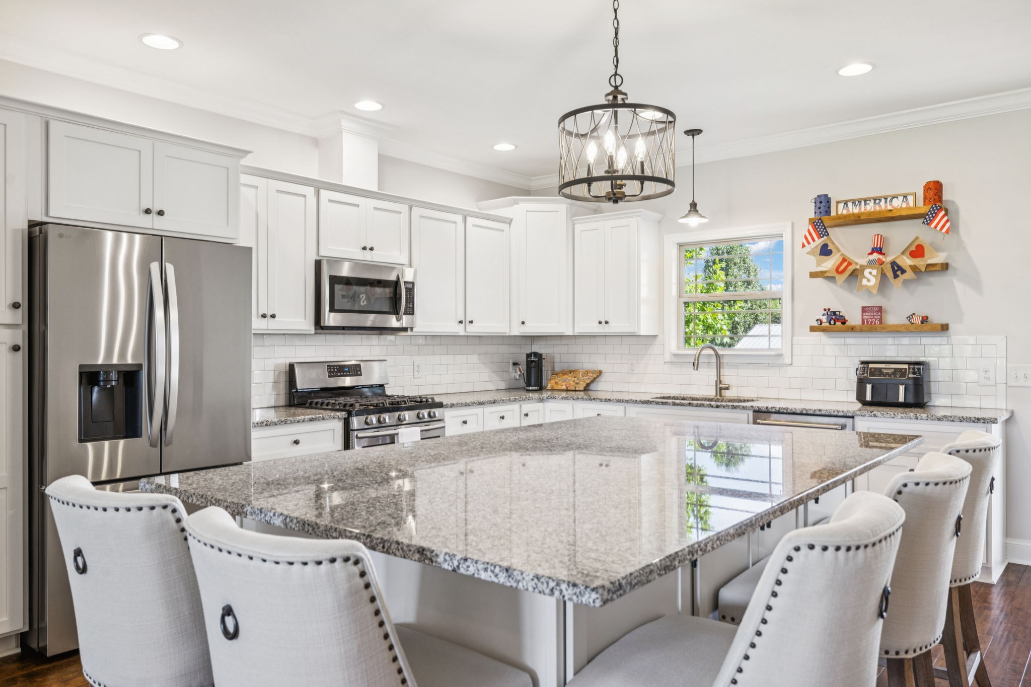 1361 Neil Road Chapel Hill, TN 37034 - Photo 6 of 24 a kitchen with stainless steel appliances granite countertop a sink a stove a refrigerator cabinets and a dining table