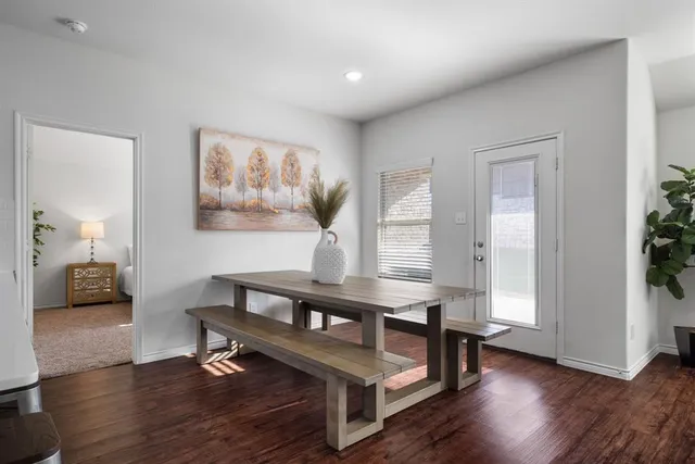 a view of a livingroom with furniture and a potted plant