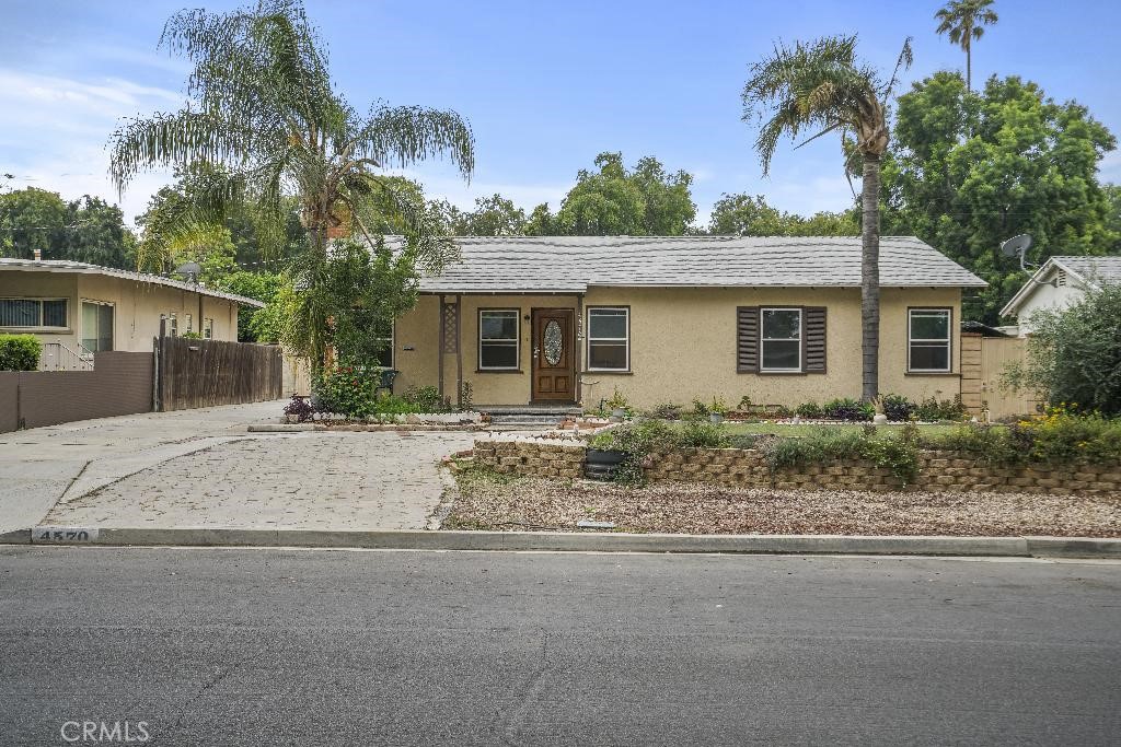 4570 Cover Street Riverside, CA 92506 - Photo 1 of 1 front view of house with potted plants and palm trees