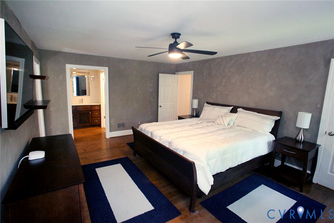 231 Hazelmere Drive Chesterfield, VA 23236 - Photo 17 of 33 a bedroom with a bed and a chandelier