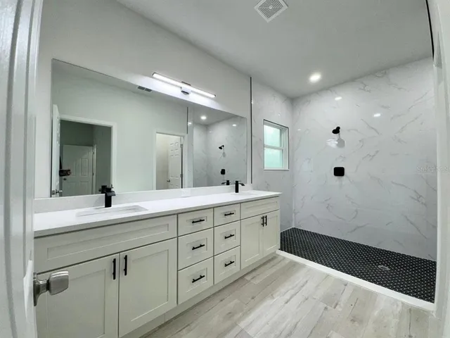 a bathroom with a sink and a mirror
