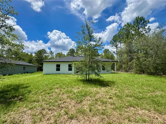 a view of a house with a garden