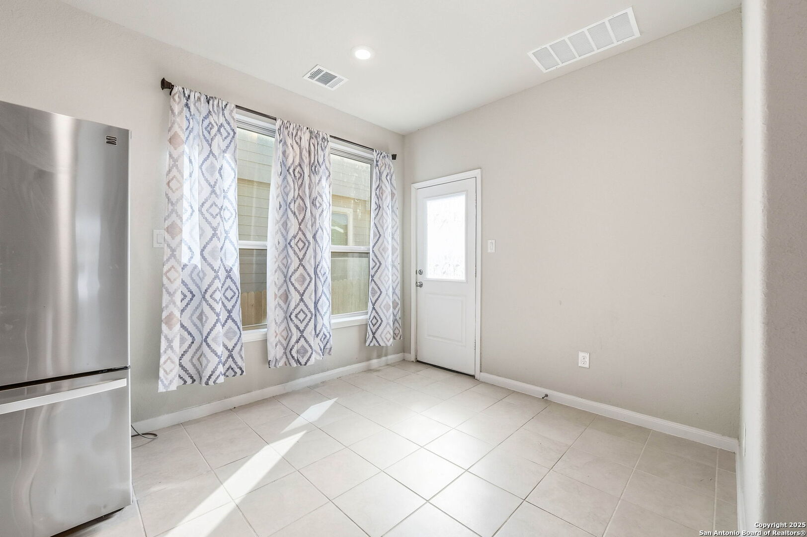 9102 Devils River Converse, TX 78109 - Photo 11 of 34 a view of an empty room with a window