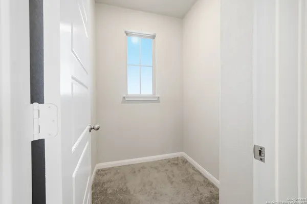 a view of an empty room and window