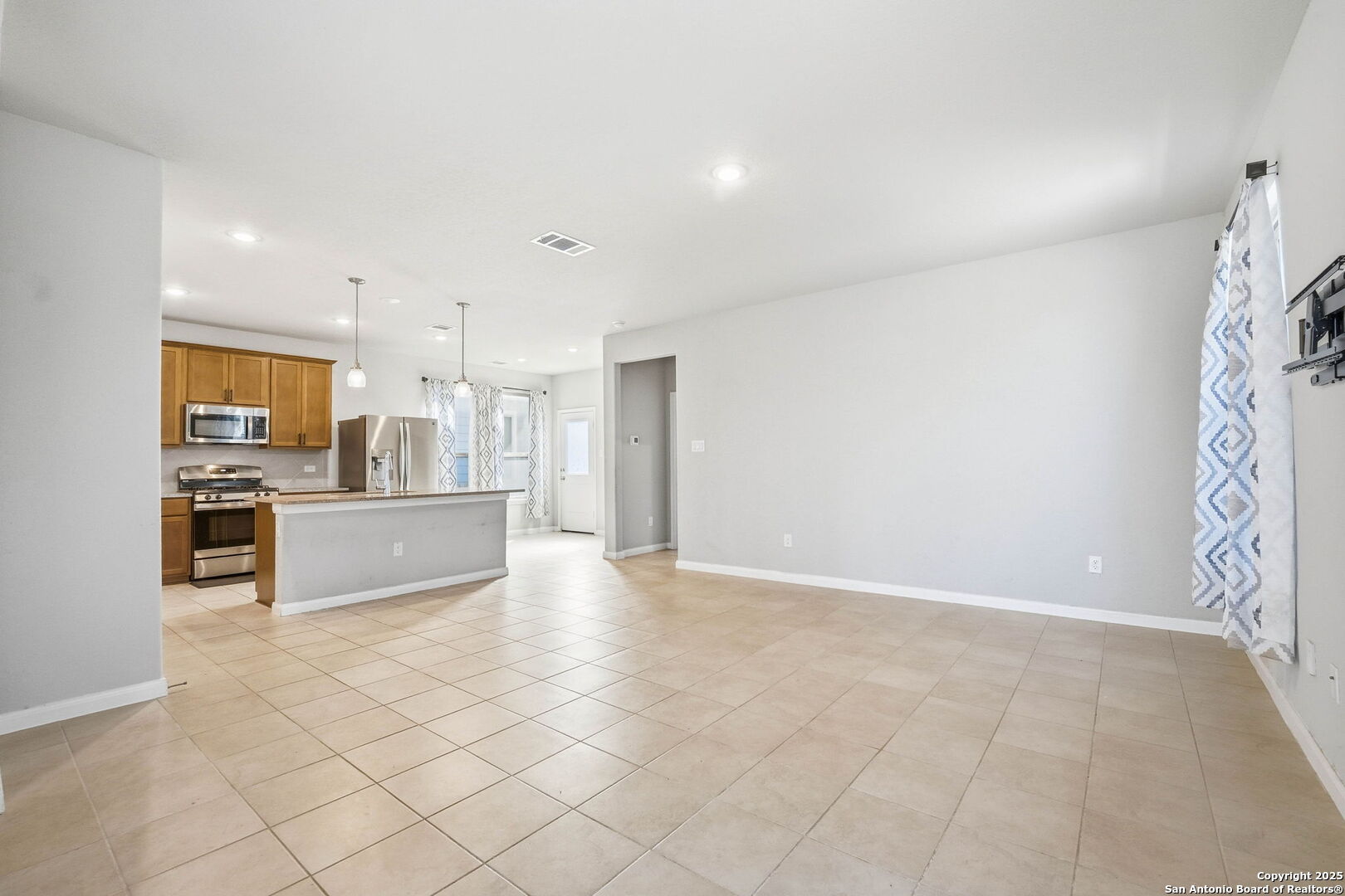 9102 Devils River Converse, TX 78109 - Photo 4 of 34 a large white kitchen with a sink and cabinets