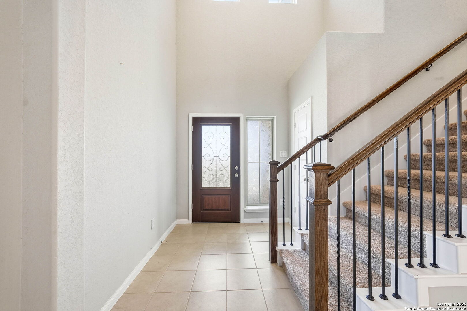 9102 Devils River Converse, TX 78109 - Photo 5 of 34 a view of an entryway with staircase