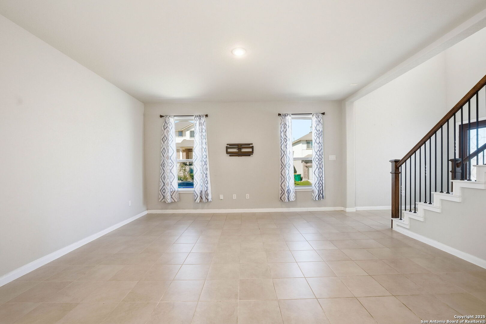 9102 Devils River Converse, TX 78109 - Photo 6 of 34 a view of an empty room with window and stairs