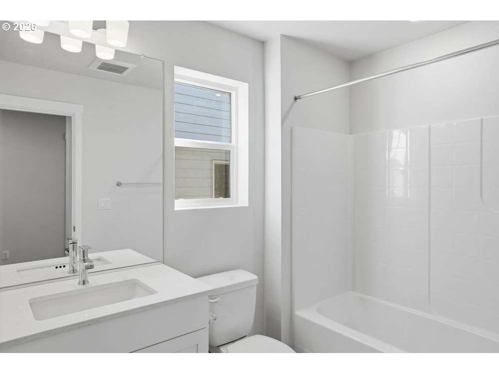 436 Southwest 32nd Street Battle Ground, WA 98604 - Photo 13 of 14 a bathroom with a sink a mirror and a shower