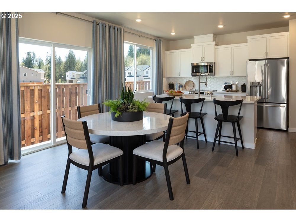 436 Southwest 32nd Street Battle Ground, WA 98604 - Photo 6 of 14 a view of a dining room with furniture and wooden floor