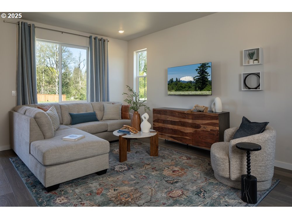 436 Southwest 32nd Street Battle Ground, WA 98604 - Photo 7 of 14 a living room with furniture and a flat screen tv