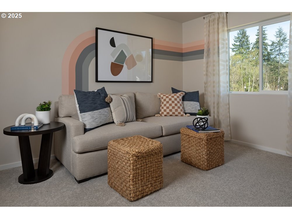 436 Southwest 32nd Street Battle Ground, WA 98604 - Photo 8 of 14 a living room with furniture and a wall painting