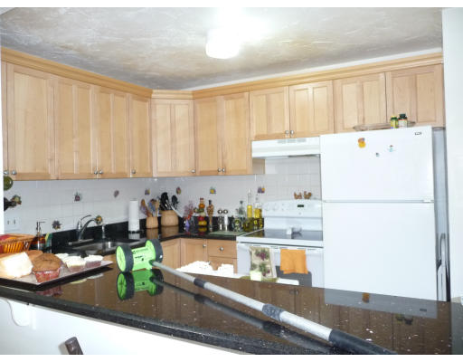 15 Weld Street, Unit 46 Framingham, MA 01702 - Photo 3 of 11 a kitchen with a refrigerator a stove and a sink