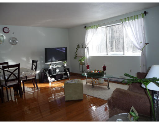 15 Weld Street, Unit 46 Framingham, MA 01702 - Photo 7 of 11 a living room with furniture and a flat screen tv