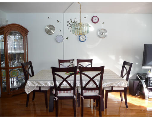 15 Weld Street, Unit 46 Framingham, MA 01702 - Photo 8 of 11 a view of a dining room with furniture and chandelier