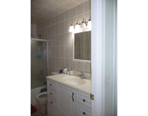 15 Weld Street, Unit 46 Framingham, MA 01702 - Photo 9 of 11 a bathroom with a sink and a mirror