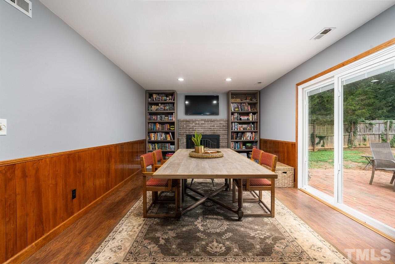 4208 Pickwick Drive Raleigh, NC 27613 - Photo 22 of 25 a view of a dining room with furniture window and wooden floor