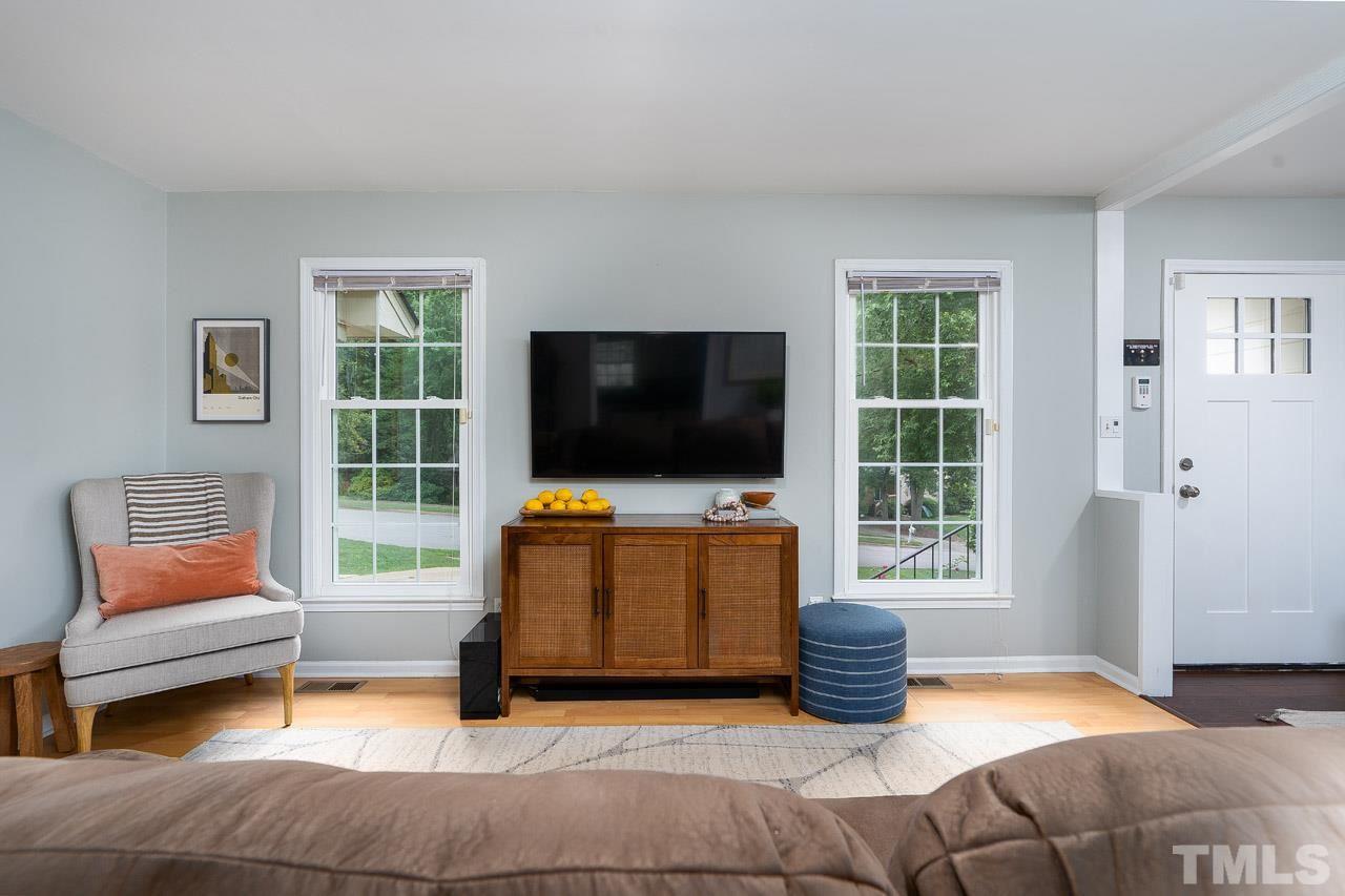 4208 Pickwick Drive Raleigh, NC 27613 - Photo 6 of 25 a bedroom with furniture and a flat screen tv