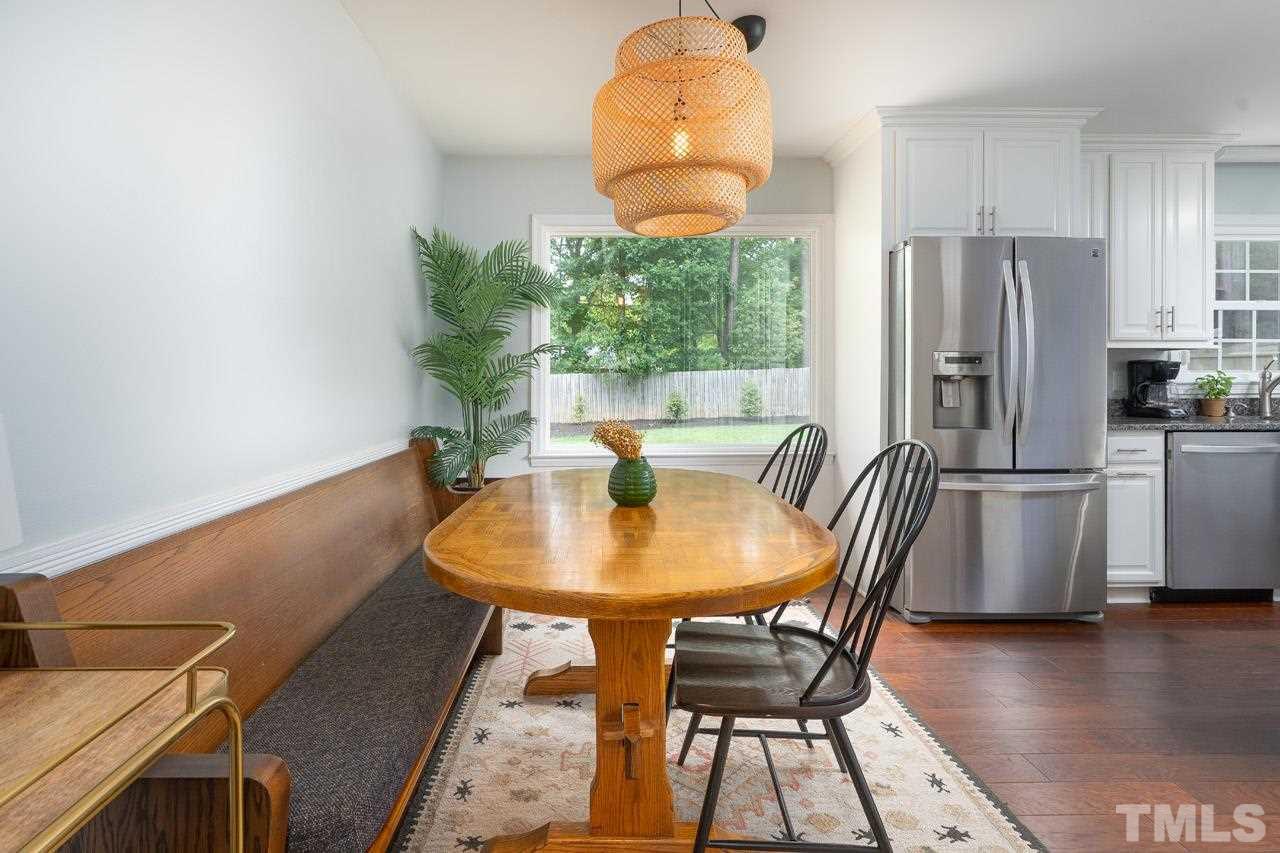 4208 Pickwick Drive Raleigh, NC 27613 - Photo 10 of 25 a dining room with furniture and wooden floor