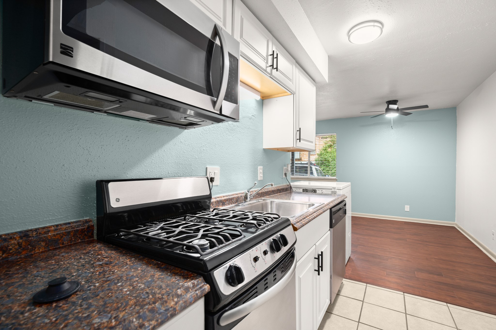 a kitchen with a stove and a microwave