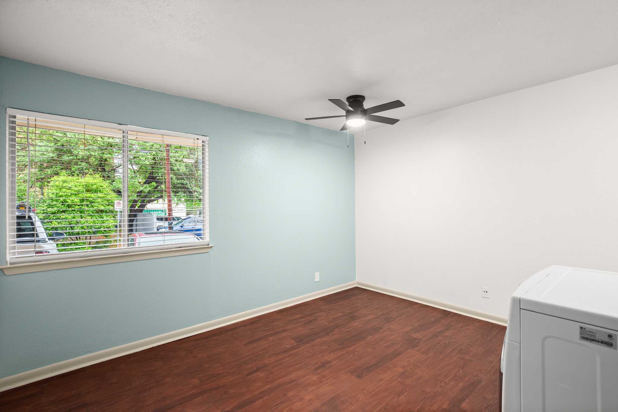1010 West 23rd Street, Unit 3 Austin, TX 78705 - Photo 5 of 15 an empty room with a window and a ceiling fan