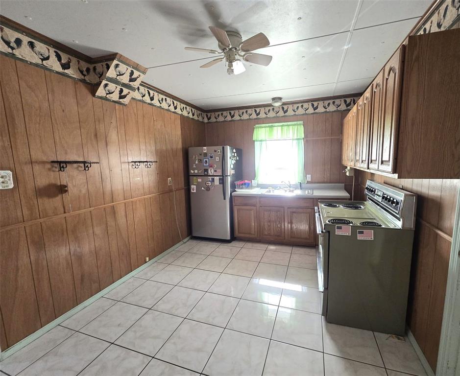 3101 Medulla Road Plant City, FL 33566 - Photo 20 of 83 a kitchen with stainless steel appliances granite countertop a refrigerator and a sink