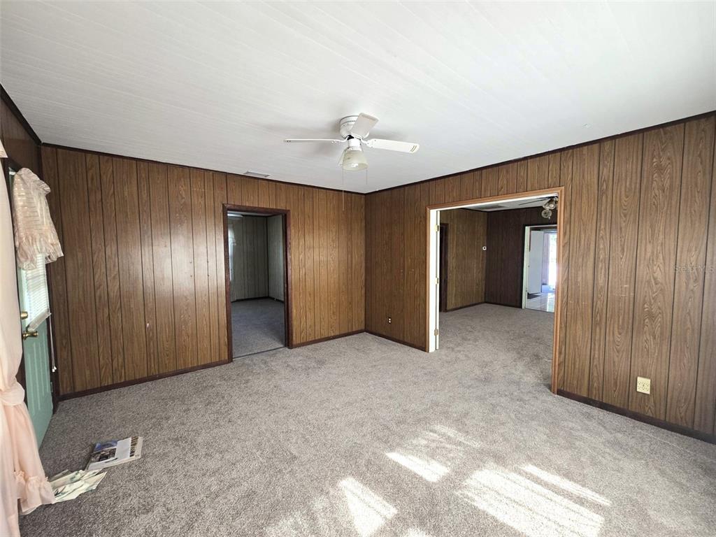 3101 Medulla Road Plant City, FL 33566 - Photo 25 of 83 an empty room with closet and a chandelier fan