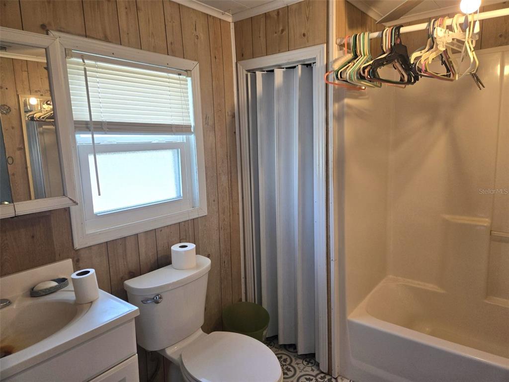 3101 Medulla Road Plant City, FL 33566 - Photo 31 of 83 a white toilet sitting next to a bathroom sink