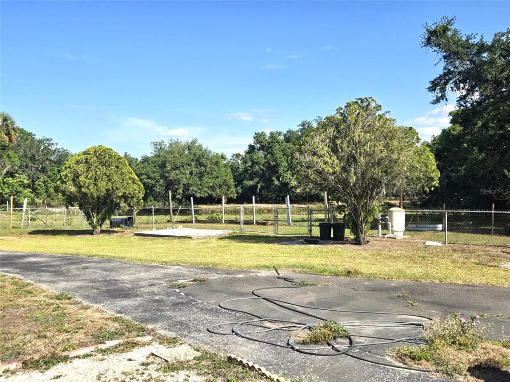 3101 Medulla Road Plant City, FL 33566 - Photo 43 of 83 a view of a swimming pool with an outdoor space and seating area
