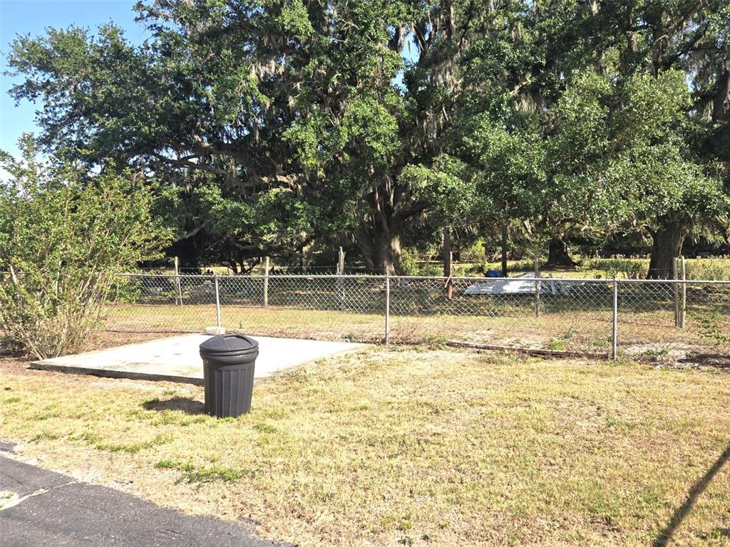 3101 Medulla Road Plant City, FL 33566 - Photo 45 of 83 a view of a swimming pool with a yard