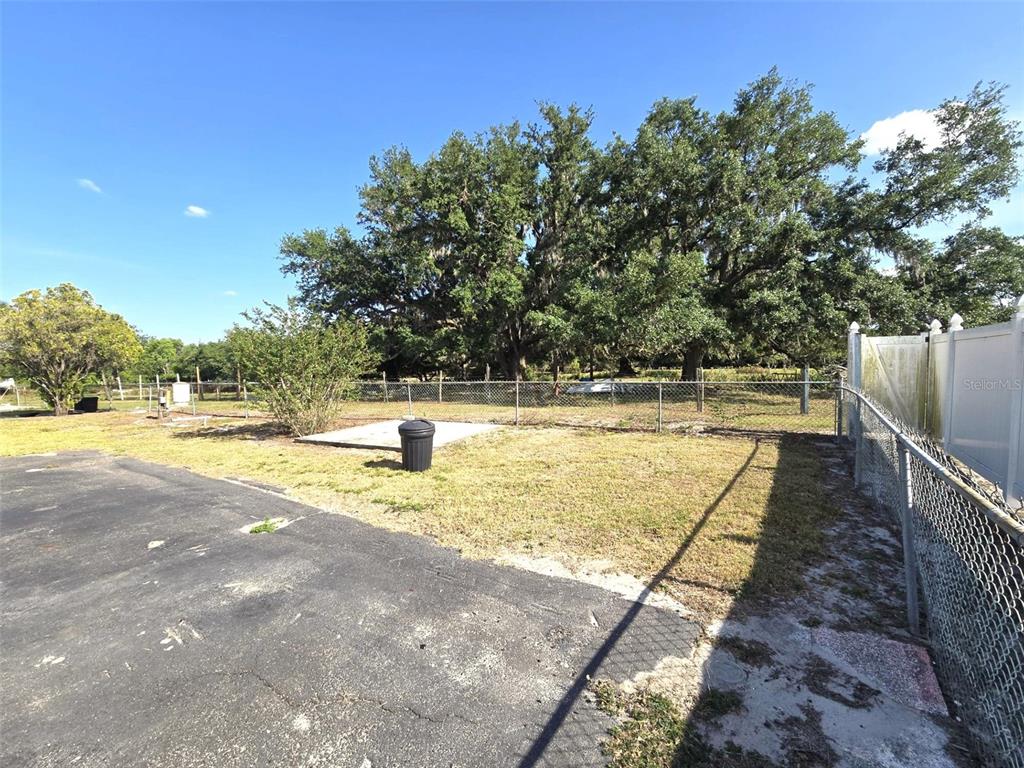 3101 Medulla Road Plant City, FL 33566 - Photo 49 of 83 a view of a swimming pool with an outdoor space and seating area