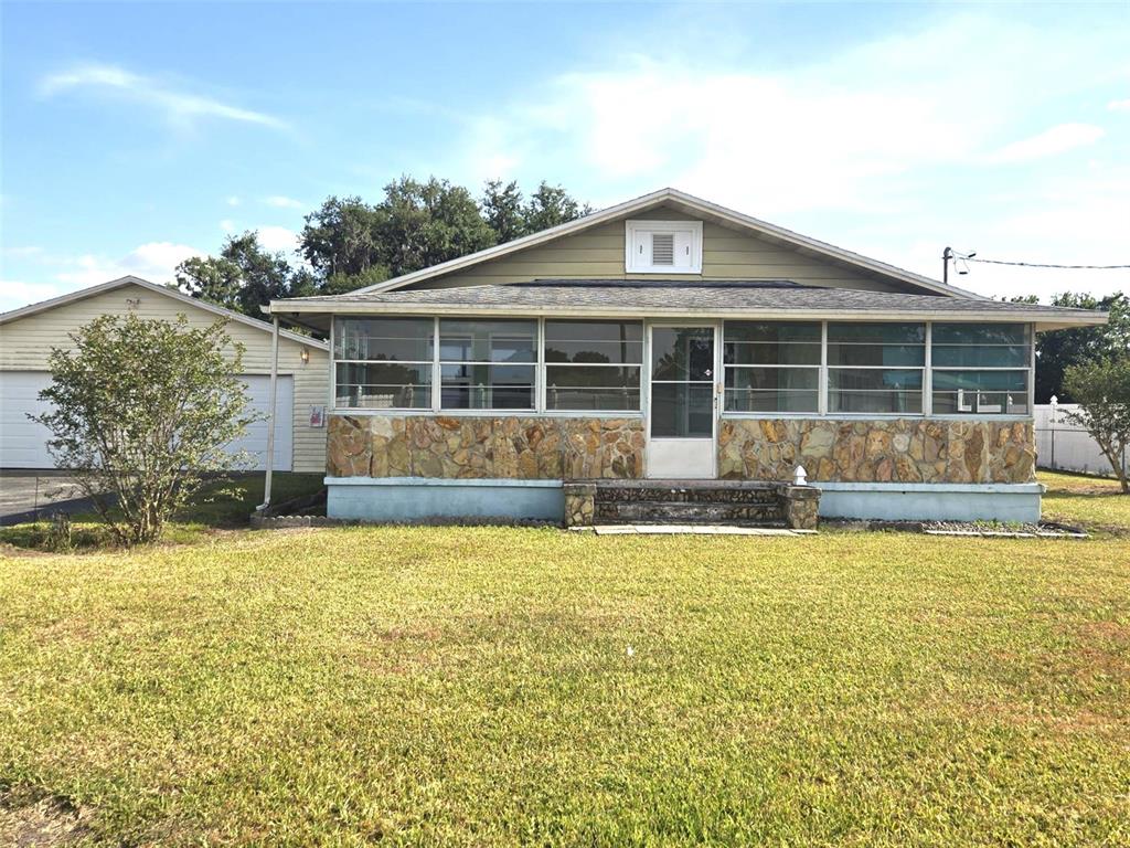 3101 Medulla Road Plant City, FL 33566 - Photo 6 of 83 a view of a house with swimming pool and a yard