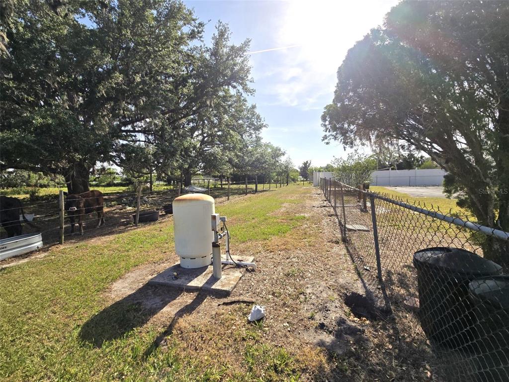 3101 Medulla Road Plant City, FL 33566 - Photo 64 of 83 a view of a lake with a patio