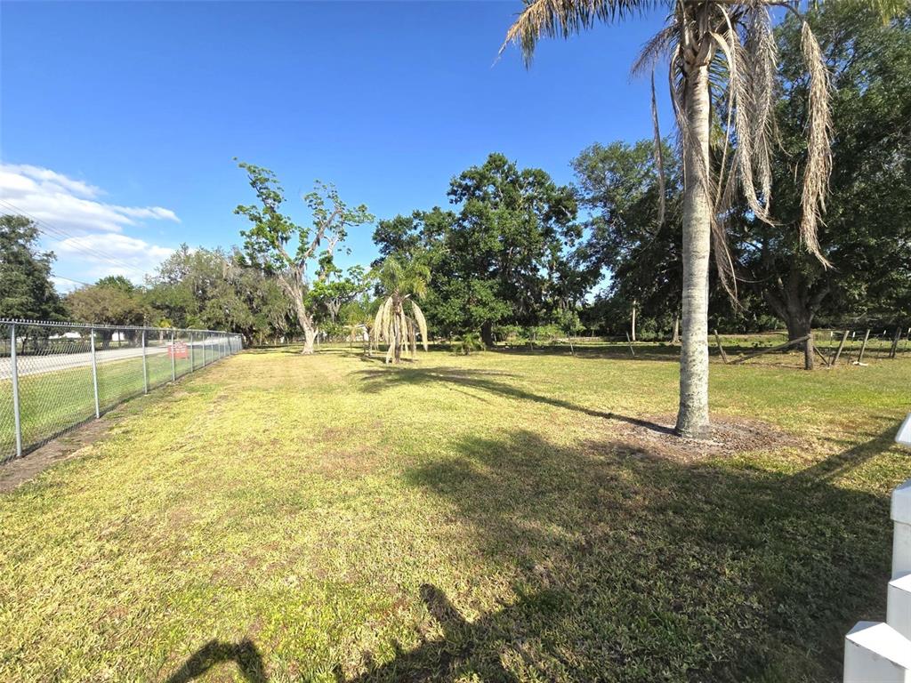 3101 Medulla Road Plant City, FL 33566 - Photo 71 of 83 a view of a swimming pool with an outdoor space and seating area