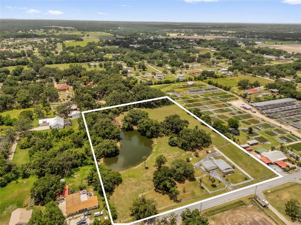 3101 Medulla Road Plant City, FL 33566 - Photo 81 of 83 an aerial view of residential houses with outdoor space