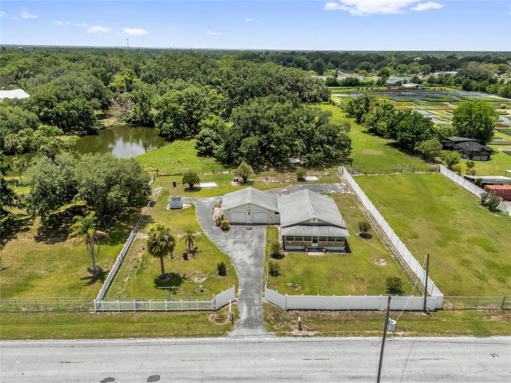 3101 Medulla Road Plant City, FL 33566 - Photo 82 of 83 a view of a swimming pool with a yard and lake view