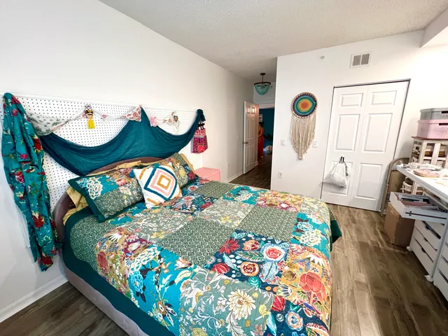 a bedroom with a bed and a table in it