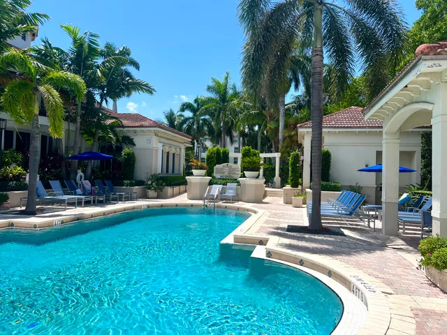 a front view of a house with a garden and a yard