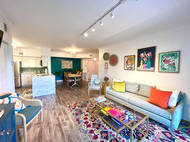 an aerial view of a house with a yard and a bench