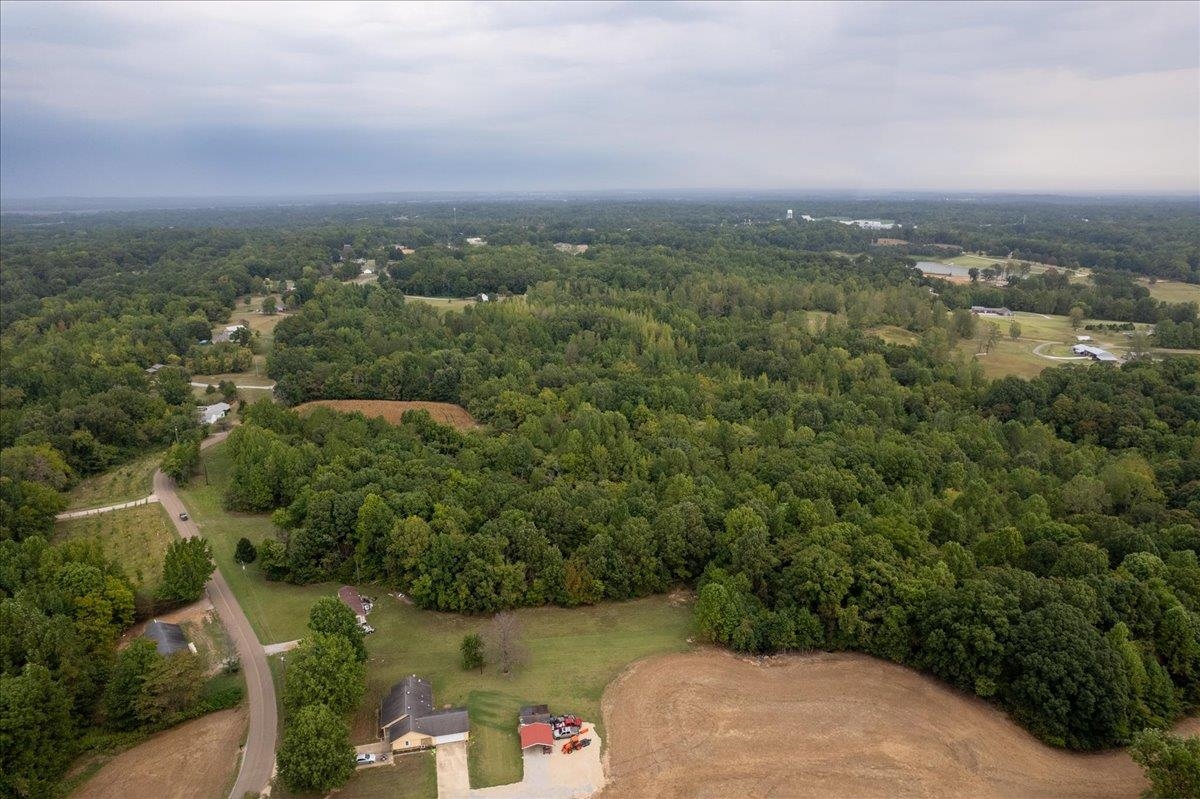 0 Hawkins Road Burlison, TN 38015 - Photo 5 of 18 an aerial view of a city with lots of residential buildings and mountain view in back