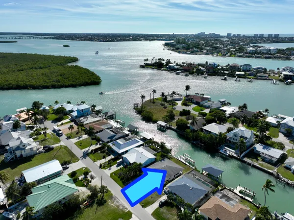 an aerial view of a house with a lake view