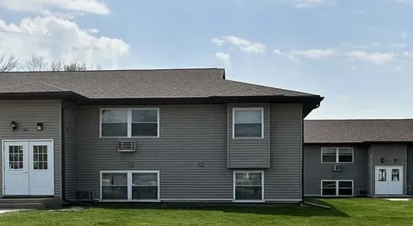 a brick house with a yard