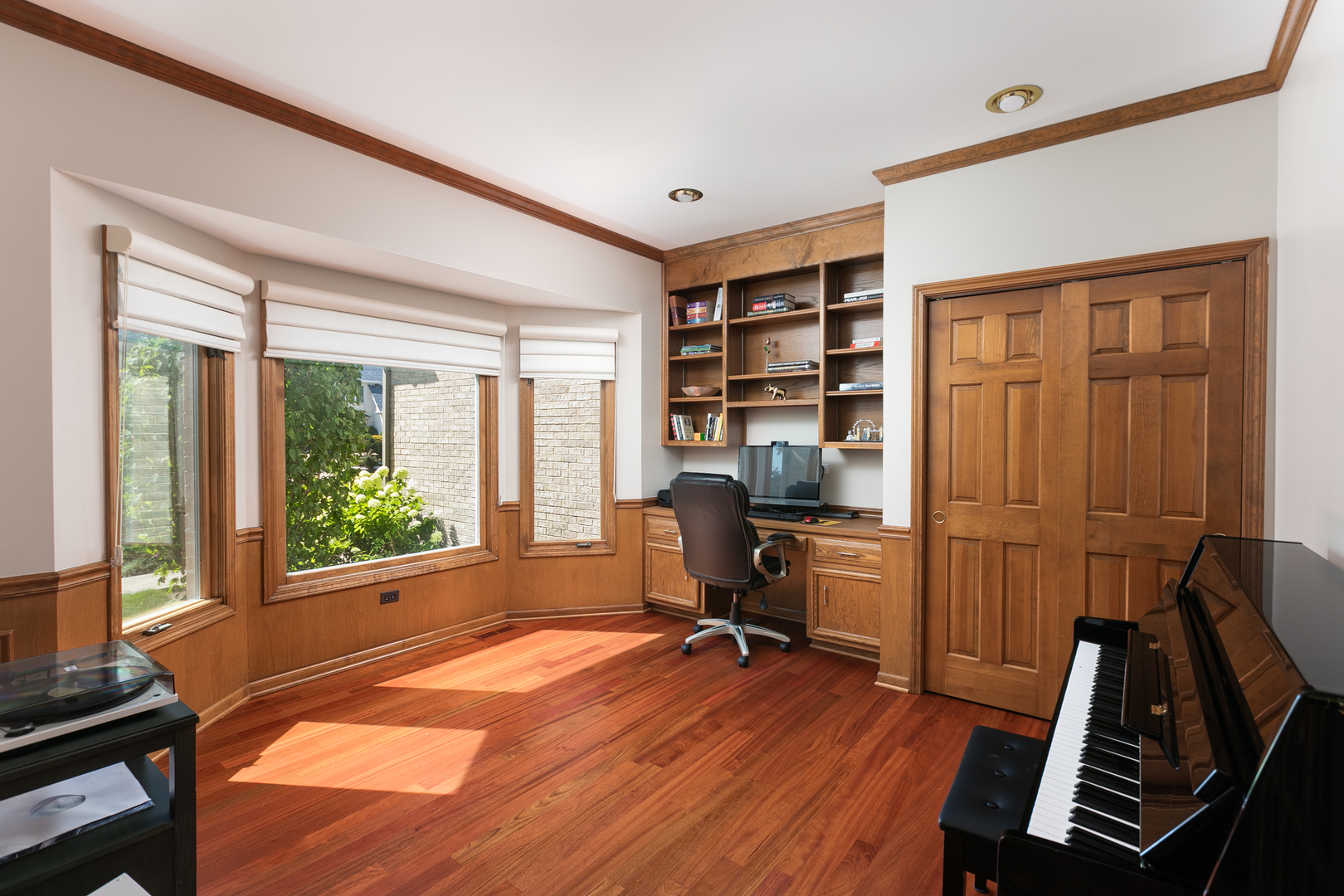 23W250 Hampton Circle Naperville, IL 60540 - Photo 13 of 42 a view of a workspace with furniture and a window