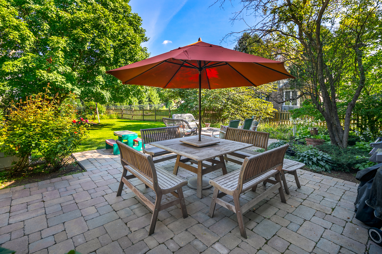 23W250 Hampton Circle Naperville, IL 60540 - Photo 3 of 42 a patio with a patio table and chairs